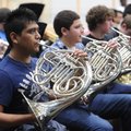 Luis Ramirez, a senior at Springdale Har-Ber High School, left, plays the French horn along with oth...