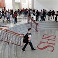 Springdale High School students walk through the commons area on Tuesday.
