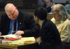 Wayne Williams, left, defense attorney, and a member of his legal team look up a ruling in a book Monday as Michael Everett Ball, right, waits for his trial to continue at the Washington County Courthouse in Fayetteville. A jury took 30 minutes to convict Ball of three counts of rape.