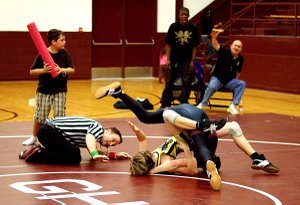Photo by Randy Moll
Tyler Easter pins his opponent during wrestling on Friday in Gentry to seal Gentry's victory over Millington Central High School.