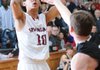 Jordan Dennis of Springdale High shoots over a Bentonville defender Tuesday as the Bulldogs took on the Tigers at Springdale High School.