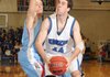 Nathan Musso, a Rogers High forward, right, moves in for a 2-point shot while guarded by Fort Smith Southside’s Sam Ross at King Arena on Tuesday in Rogers.