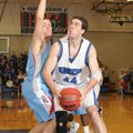 Nathan Musso, a Rogers High forward, right, moves in for a 2-point shot while guarded by Fort Smith ...