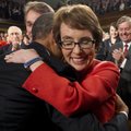 President Barack Obama embraces retiring Rep. Gabrielle Giffords, D-Ariz., as members of Congress ap...