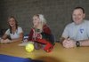 Heather Scott, Rogers High softball player, center, will play her next season at Labette Community College in Parsons, Kan. With Scott is her mom, Brandy Scott, and dad, Jeff Scott.