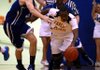 North Little Rock's DayShawn Watkins dribbles away from Bryant's Quinton Motto in their game at NLR HS gym Tuesday.