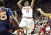 Arkansas guard BJ Young (11) pulls up for a shot over Auburn defenders on a fast break during the first half of the Razorbacks’ 56-53 victory Wednesday at Walton Arena in Fayetteville. Young led Arkansas with 11 points. 