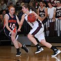 Destiny Thomas, a Gentry point guard, drives past Rogers Heritage’s Raya Jones in an early season ga...