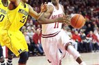 Arkansas Democrat-Gazette/WILLIAM MOORE
Arkansas' BJ Young drives against Michigan's Trey Burke Saturday, January 21, 2011 at Bud Walton Arena in Fayetteville.