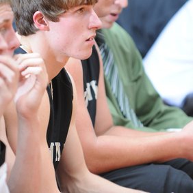 EYE OF THE TIGER Mason Snow, Bentonville, waits on the bench Tuesday at Springdale High School, ready to get back in the game against the Bulldogs.