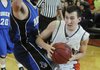 Luke Fryauf, Rogers Heritage, right, tries to drive around Rogers High’s Trevor Hampton on Jan. 20 at Heritage High.
