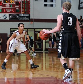 Jordan Dennis, left, a Springdale High guard, has some of his toughest battles at home against his older brother, Tony, who is also a guard for the Bulldogs.