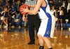 Hunter Hill, Rogers guard, looks to pass around Fort Smith Southside defenders Tuesday at King Arena in Rogers.
