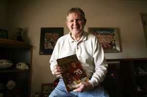 Wingback Harry Jones was the first Arkansas football player to make the cover of Sports Illustrated, a copy of which hangs in a frame behind him. “I was totally in awe of that,” said Jones, who played five seasons in the NFL after three seasons with Arkansas. 