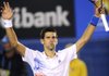 Novak Djokovic of Serbia celebrates after defeating David Ferrer of Spain during their quarterfinal at the Australian Open tennis championship, in Melbourne, Australia, Wednesday, Jan. 25, 2012.  (AP Photo/Andrew Brownbill)
