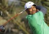 Tiger Woods from U.S. tees off on the 14th hole during the first round of Abu Dhabi HSBC Golf Championship in Abu Dhabi, United Arab Emirates, Thursday, Jan. 26, 2012. (AP Photo/Kamran Jebreili)