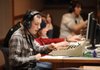 Daniel Masse, a senior at Fayetteville High School, speaks into a headset while changing cameras Thursday while manning the technical director’s controls during a taping of “Bulldog Pause” at Fayetteville Public Schools’ production studio at the high school.
