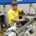 David Halcomb practices using a manual lathe Wednesday at Northwest Technical Institute’s campus in ...