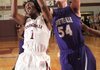 Jarvis Odems, left, a Springdale High senior, and Fayetteville junior Tyler McCullough battle for a rebound during the first half of Friday’s game at Springdale High.
