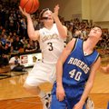 Austin Haggard, Bentonville guard, left, shoots for two points over Rogers Guard Josh Anderson at Ti...