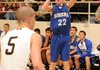 Rogers’ Collin Jones, right, attempts a 3-pointer against Bentonville at Tiger Arena in Bentonville on Friday.
