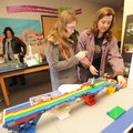 BRIDGE BUILDING Katie Jackson right, of Fayetteville, and daughter Emily, a sixth-grader at Holt Mid...