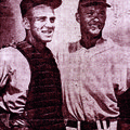 Elmer “B” Lindsey is joined in this 1960 photograph by future St. Louis catcher Tim McCarver (left) ...