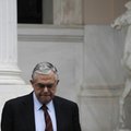 Prime Minister Lucas Papademos leaves his office after meeting the leaders of the three parties back...