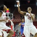 Arkansas Democrat-Gazette/WILLIAM MOORE -- Arkansas' Ashley Daniels (12) and Dominique Robinson (21)...