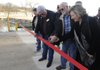State Sen. Cecile Bledsoe, R-Rogers, from right, Dale King, Benton County justice of the peace, and Bob Clinard, county judge, cut a ribbon Friday at the James Fulfer Bridge over Sugar Creek on Minch Spring Road. Officials attended a ribbon cutting for the improved bridge that opened in late November after it was damaged by April flooding.