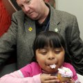 Jaquelin Troncoso, an Eastside first-grader, taste tests a cupcake with bubblegum flavored frosting ...