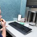 Noah Scherer, an Eastside first-grader, taste tests a slice of apple in the sensory testing lab at t...