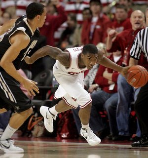 Arkansas junior Julysses Nobles races up the court after stealing the ball from Vanderbilt junior John Jenkins during the first half at Bud Walton Arena in Fayetteville on Tuesday.