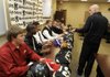 STAFF PHOTO J.S. WEDGEWORTH -- Bentonville football coach Barry Lunney talks to the eight players from the team signing letters of intent Wednesday, Feb. 1, 2012, to play college football prior to a signing ceremony at the Tiger Athletic Complex in Bentonville. 