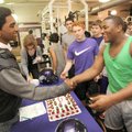 STAFF PHOTO ANDY SHUPE -- Fayetteville senior Casey Perry, left, is congratulated Wednesday, Feb. 1,...