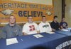 STAFF PHOTO FLIP PUTTHOFF -- Rogers Heritage High School football players Jonathan James, from left, Billy Couch, Max Hotelling, Joshua Henderson and Luke Oldham signed scholarship paperwork at a signing ceremony on Wednesday.