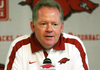 Arkansas head coach Bobby Petrino speaks at media day last August at Razorback Stadium in Fayetteville.