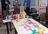 Kelly Kemp-McLintock, second from left, chief advancement officer for the Jones Center, speaks Wednesday to Karen Parker, from left, senior manager for the Walmart Foundation, Sarah Van Vleck, advancement coordinator for the Jones Center, and Evan Carver, a Jones Center intern, in the YOUth Center’s art room at the Jones Center. The Walmart Foundation presented the center with a $250,000 check to support youth programs, the YOUth Center and the Summer Youth Academy.