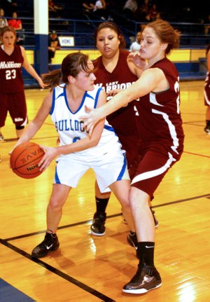 Decatur senior Kourtnee Funk looked to pass the ball during Monday’s non-conference game against the Oaks, Okla. Warriors. The Lady Bulldogs lost the game 57-26.