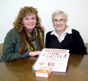 Chris Nelson, a volunteer tutor for the Community Literacy Program of Decatur, and Boni Vrieze, coordinator of the program, show some of the program’s teaching materials.