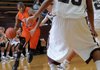 Xavier Thomas, left, a Rogers Heritage guard, tries to drive against Gentry in the War Eagles season opener on Nov. 18. Thomas, a junior move-in from Kentucky, is six points per game for the War Eagles.
