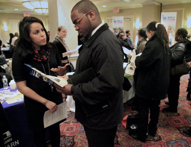 in-this-jan-25-2012-photo-daniela-silveroleft-an-admissions-officer-at-asa-college-discuss-job-opportunities-with-patrick-rosarie-who-is-seeking-a-job-in-it-during-jobexpos-job-fair-in-new-york