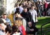 People wait in line Thursday at a job fair in Tigard, Ore. In the most biggest surge in the job market since early last year, the United States added 243,000 jobs in January, far more than economists expected. 