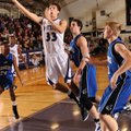 WHEN ’DOGS FLY Caleb Waitsman, Fayetteville junior forward, scores past Rogers senior post Nathan Mu...