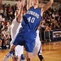 GOING UP Josh Anderson, a Rogers High senior forward, takes a shot in the lane past Fayetteville jun...