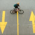 DOWN AND UP Thomas Goodwin of Fayetteville walks his bicycle Friday up Mountain Street while on his ...