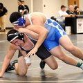 Edwin Santos, Rogers High, right, tries to subdue Springdale High’s Hugo Herrera in the Bentonville ...
