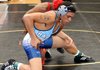 Springdale Har-Ber’s Ryan Harrison, front, grapples with Fort Smith Northside’s Daiquon Jackson during the Bentonville Tiger Classic earlier this season. Har-Ber will host the 7A-West Conference meet today in Wildcat Arena.