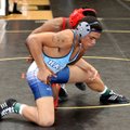 Springdale Har-Ber’s Ryan Harrison, front, grapples with Fort Smith Northside’s Daiquon Jackson duri...