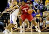 Arkansas' Devonta Abron (4) works the ball against LSU's Storm Warren during an NCAA college basketball game, Saturday, Feb. 4, 2012 at Pete Maravich Assembly Center on the LSU campus in Baton Rouge, La. (AP Photo/The Advocate, Libby Isenhower)